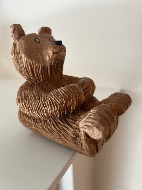 Bear Sitting on Edge