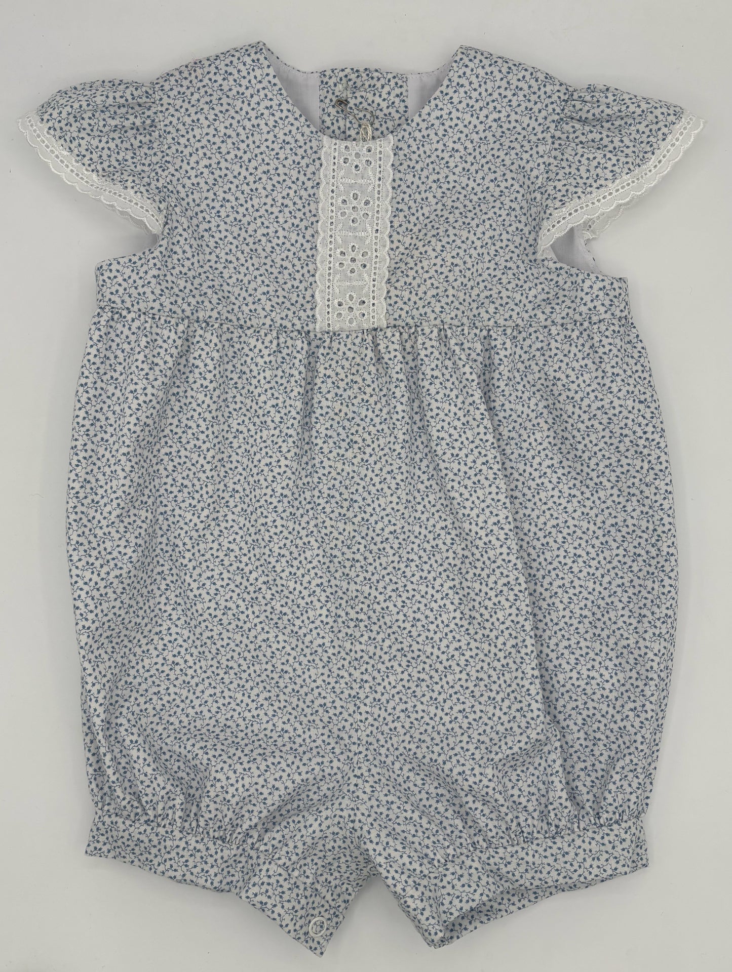 6 M Blue and White Floral Romper with Eyelet Sleeves and Trim