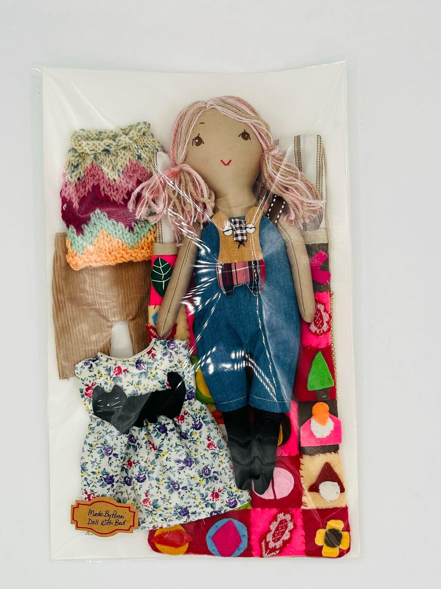 Doll with Quilted Bed and Three Outfits