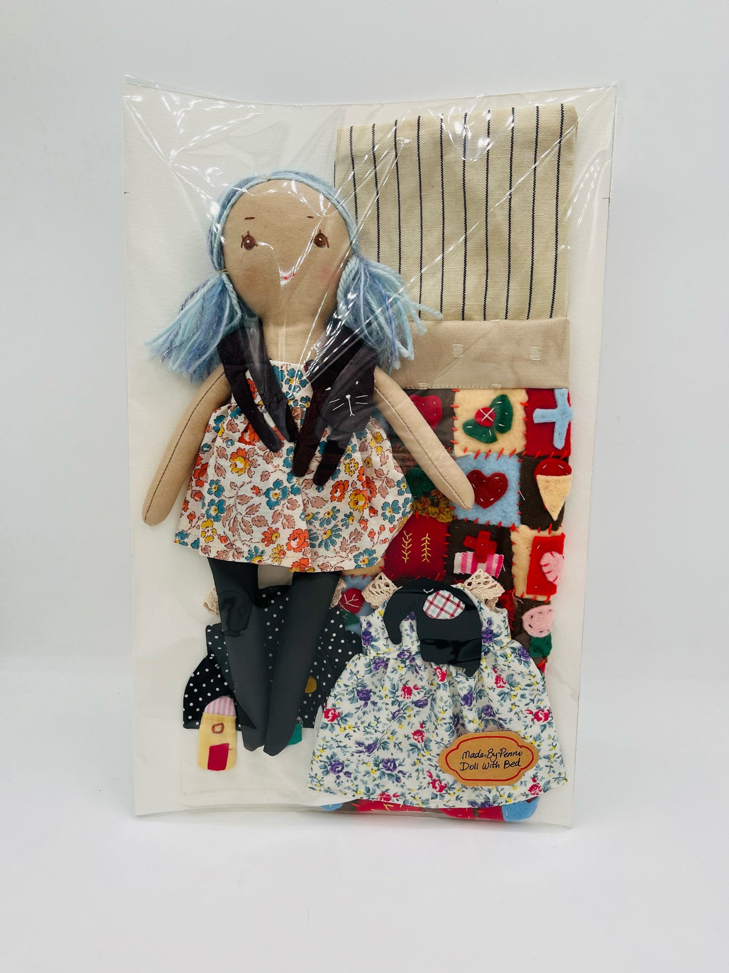 Doll with Quilted Bed and Three Outfits