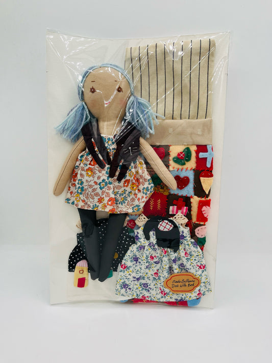 Doll with Quilted Bed and Three Outfits