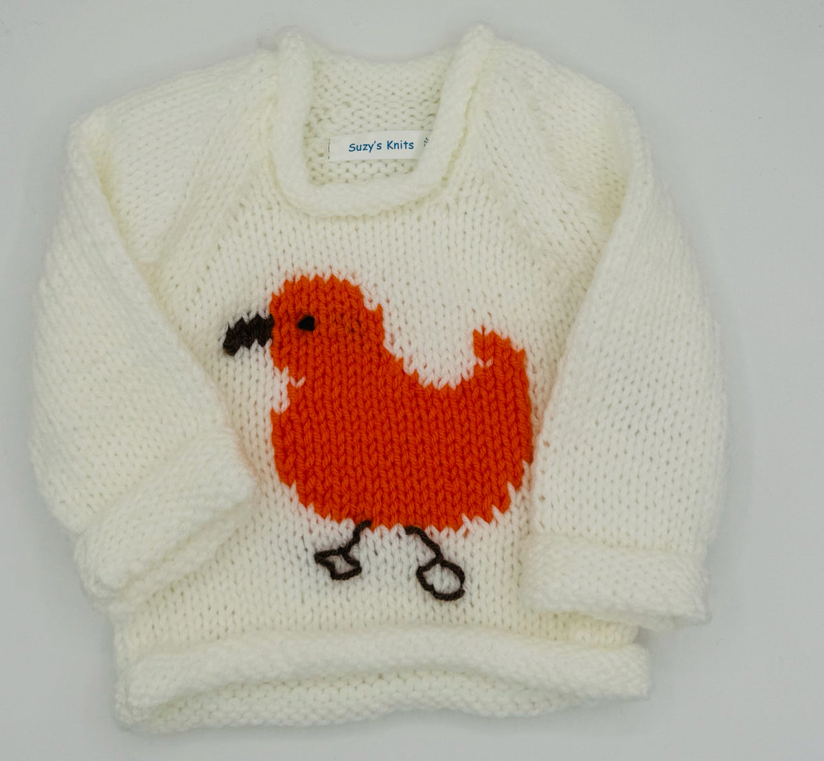 12 M White Acrylic Sweater with Orange Chick