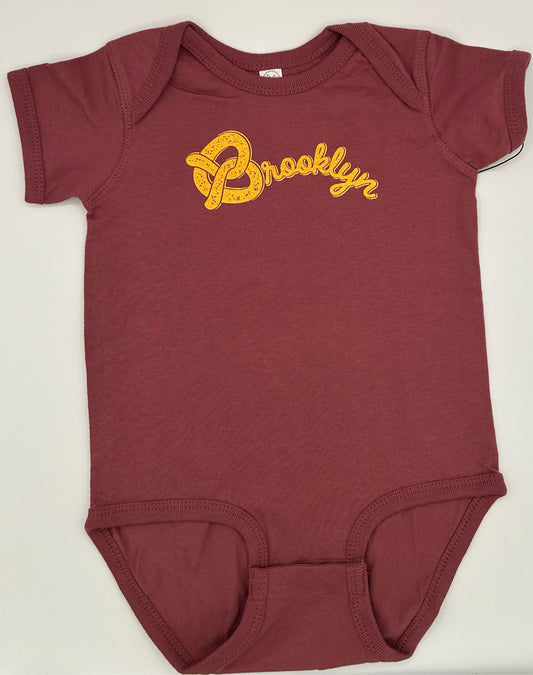 Brooklyn Pretzel Onesie yellow on rouge size 18M